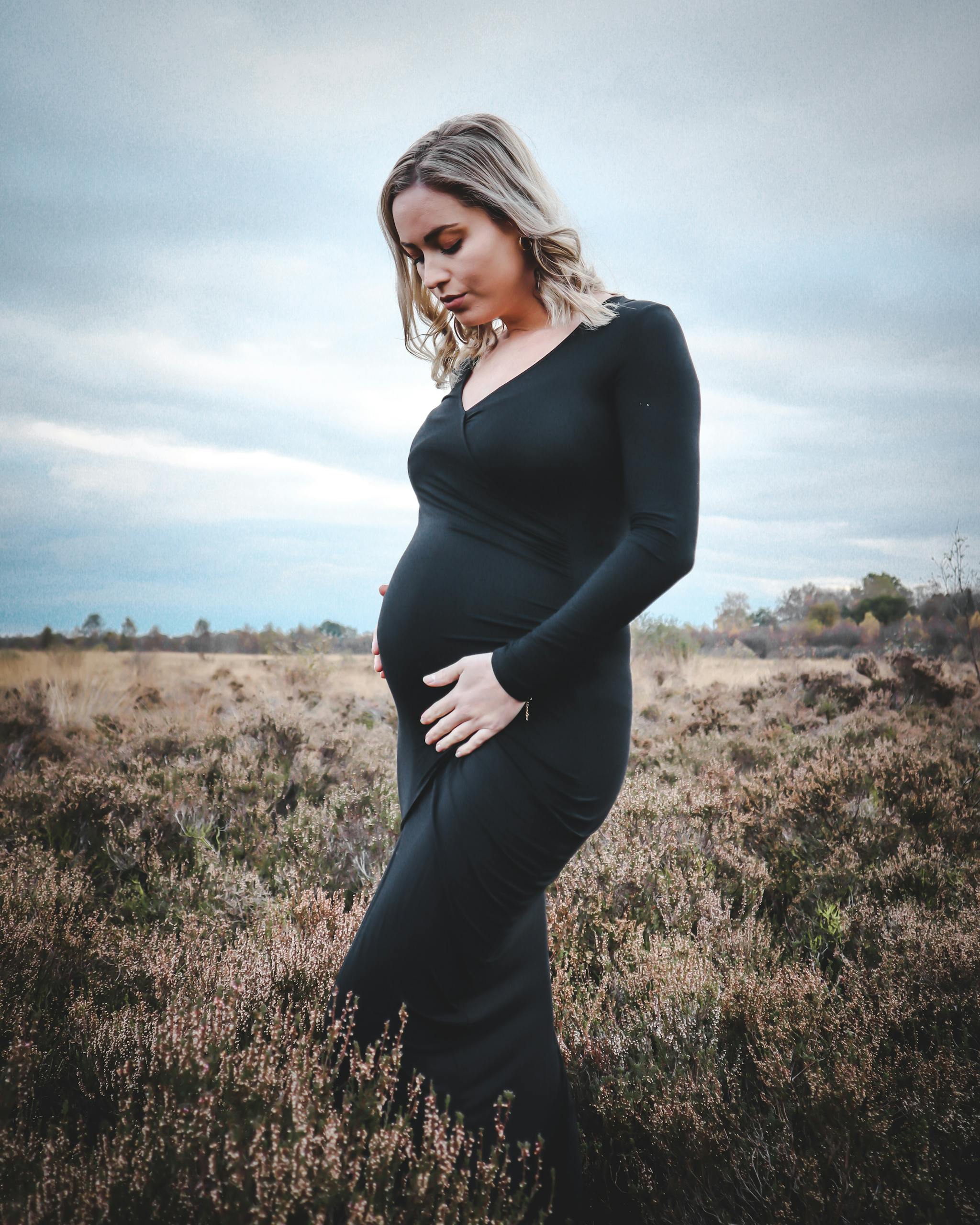 Photo Of Pregnant Woman Wearing Black Dress